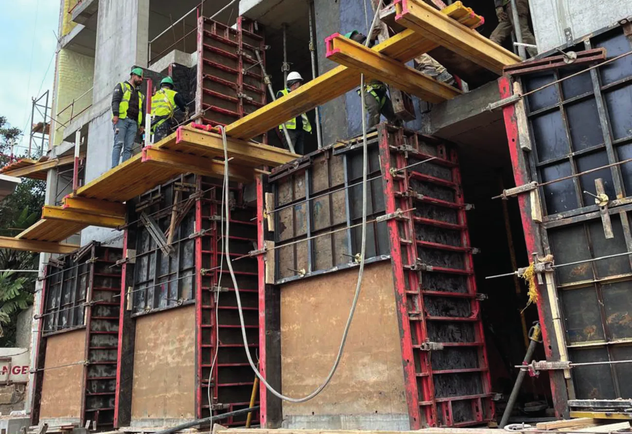 Bosch site — rammed-earth walls being built in their formwork
